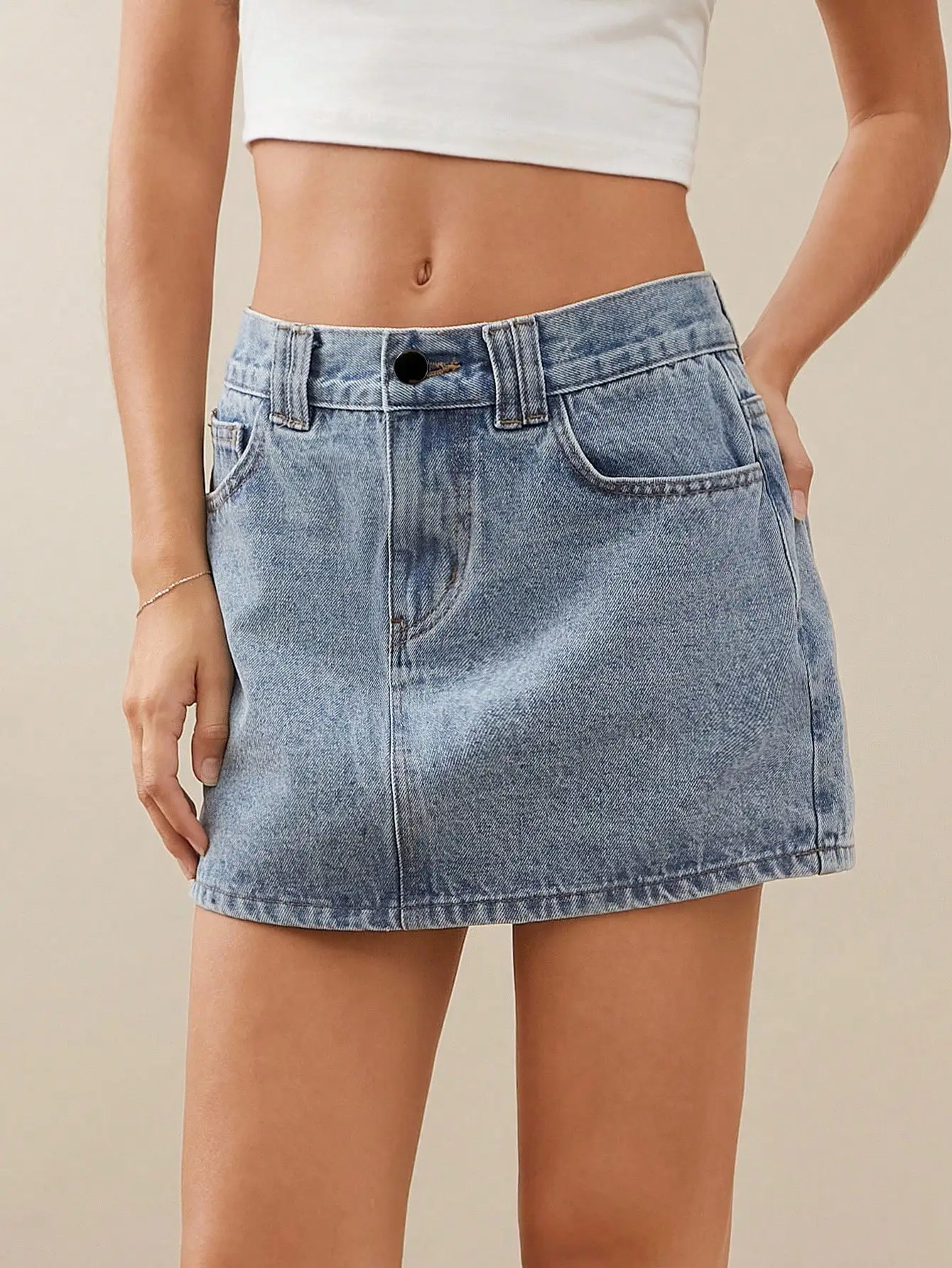 Light Wash Denim Mini Skirt with Front Button Closure and Pockets