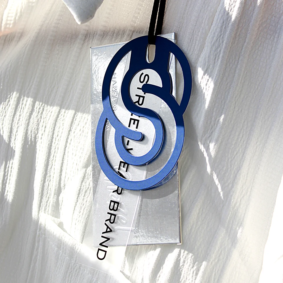 

Custom LOGO Printed Clothing Hangtag Laser Silver Cardboard Hollow Out Die Cut Swing Tags Transparent PVC Garment Label
