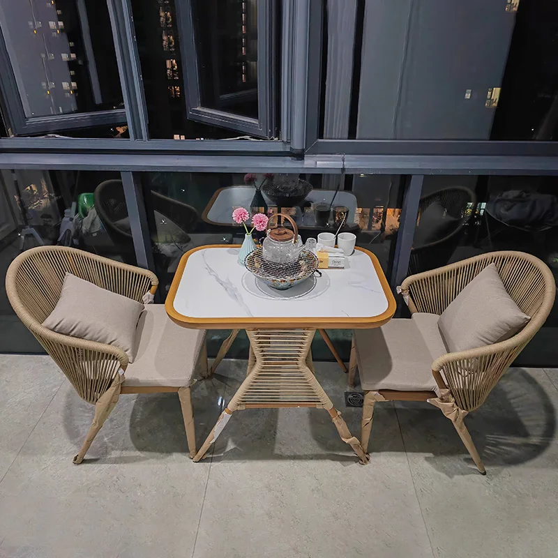 

Balcony leisure table and chair three-piece combination outdoor rattan chair creative Internet celebrity one table two chairs re
