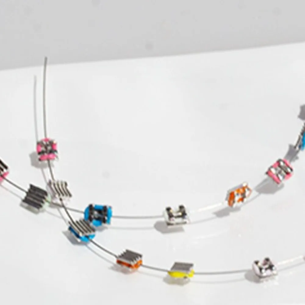 

1 Pair Colorful Temporary Tooth Decoration Dental Decorations with Metal Wires Orthodontic Ligature Ties Fake Brackets Braces