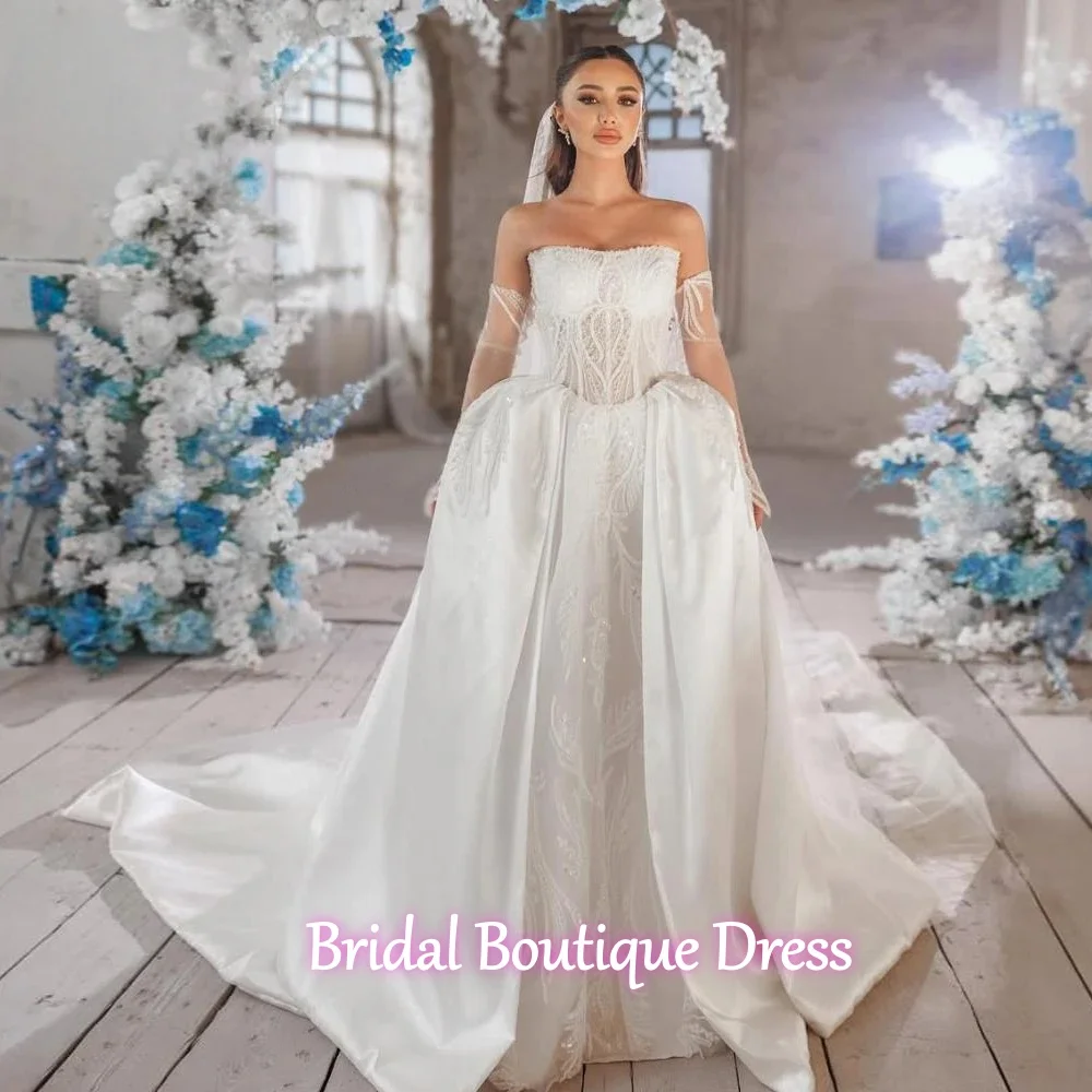 فساتين زفاف نسائية رائعة مخصصة على شكل حرف A مزينة بالدانتيل بدون ظهر رداء العروس بأكمام طويلة فيستدو دي نوفيا