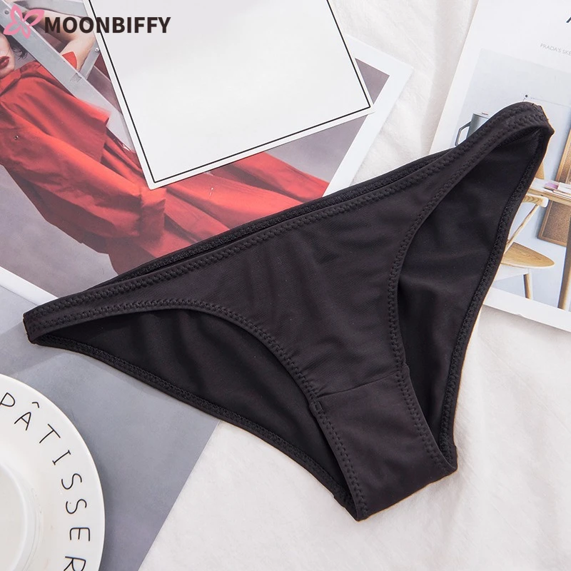 Tanga Sexy de cintura baja para mujer, bragas semi cubiertas para glúteos, seda de leche suave, Tanga triangular de Color sólido, bragas Unisex