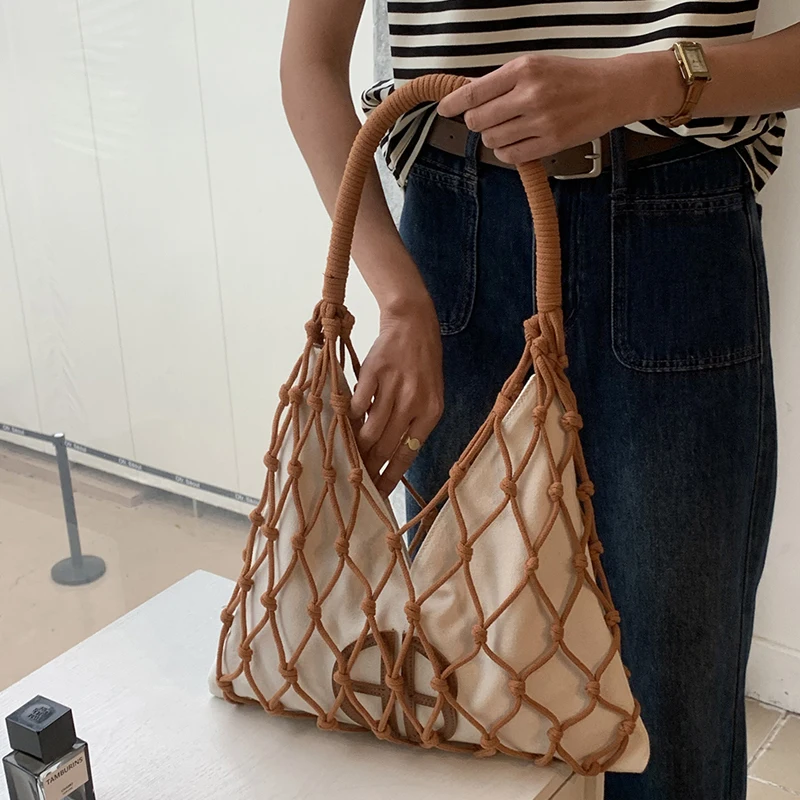 Sacos de praia finos ocos para mulheres bolsas e bolsas de designer de luxo 2024 novo em corda de náilon trançado lona bolso interno tecido alça superior nas axilas bolsa de ombro alta qualidade Frete grátis