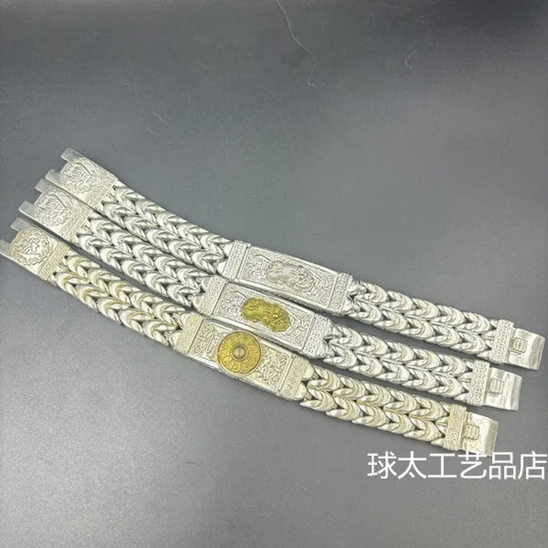 silver-plated-white-copper-double-chain-bracelet-with-a-peace-symbol-and-a-money-charm-in-form-of-a-mythical-called