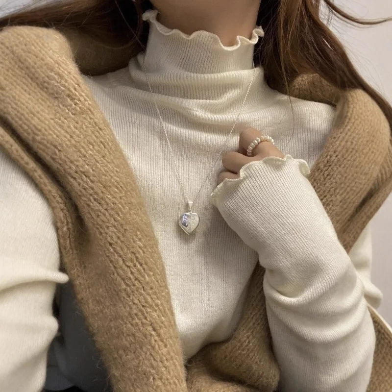 

2025Осенне-зимний однотонный женский облегающий трикотаж с высоким воротником, жилет с деревянными краями и ушками, новый стиль, мода