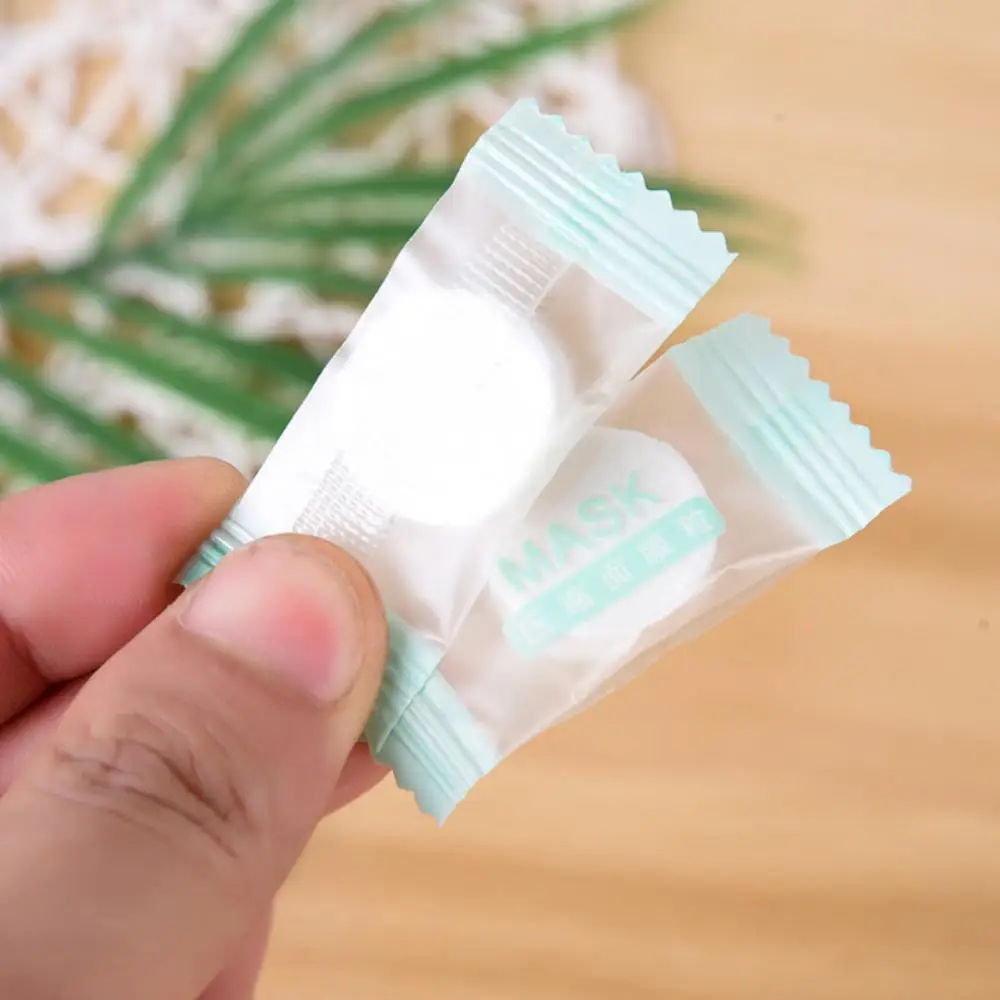 Mascarilla comprimida para el cuidado de la piel, no tejidos desechables, mascarilla comprimida de papel, mascarilla Facial hecha para el cuidado de la piel, embalaje independiente de tela