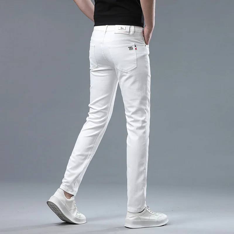 

Autumn pure white jeans men's high-end and fashionable trendy casual all-matching street stretch slim-fit light luxury trousers