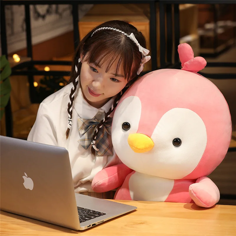 Children's plush penguin doll is warm and warm