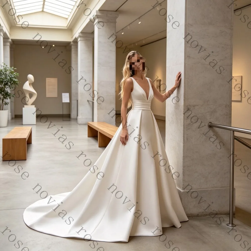 Customized 2026 Satin Deep V-neck A-line Wedding Dress Long Sleeveless Design Elegant Bridal Gown Suitable for Modern Ceremonies