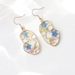 Unikalny kształt twarzy suszone kolczyki kwiatowe kreatywne kolorowe tłoczone kolczyki kwiatowe ręcznie robione kolczyki z żywicy epoksydowej naturalny kwiat