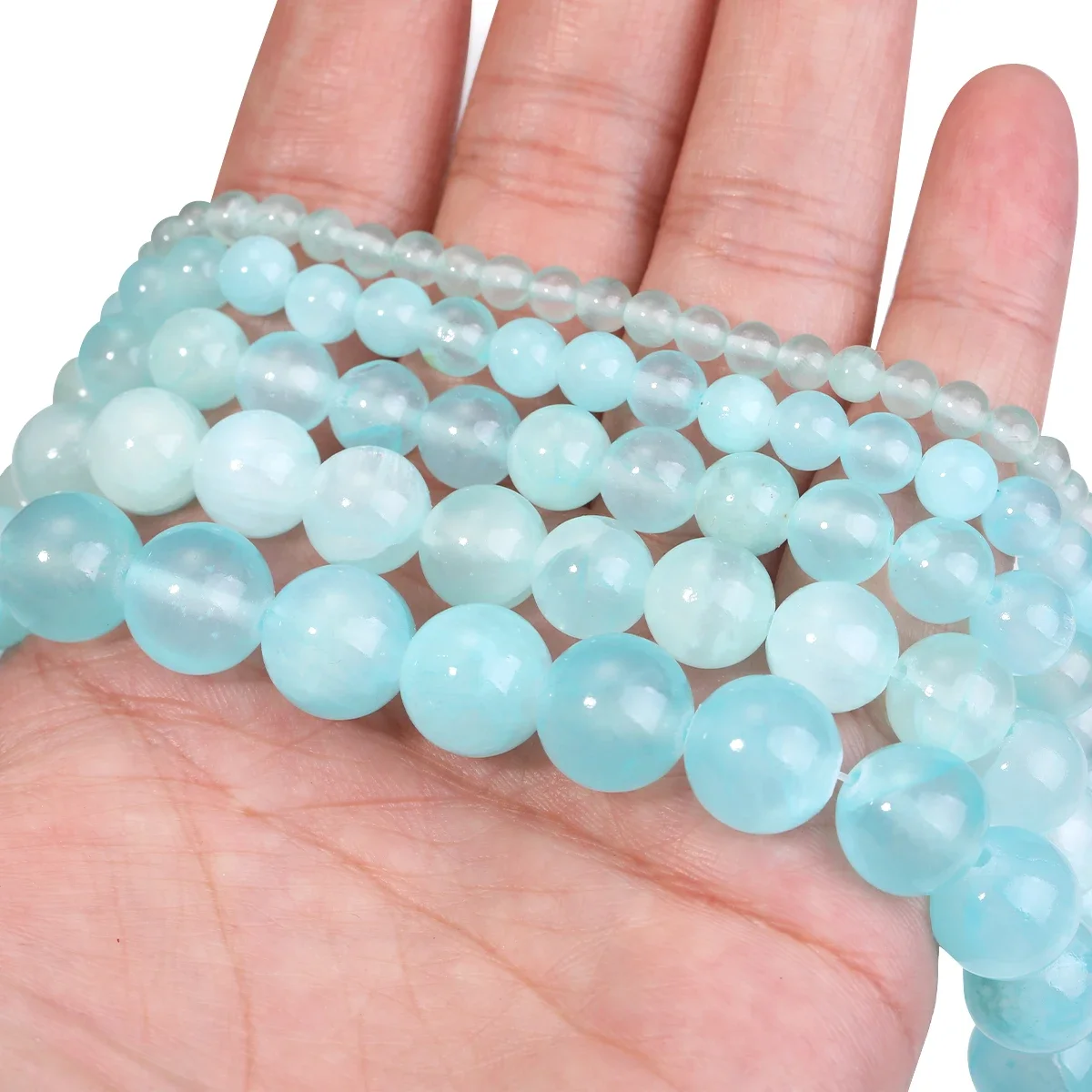 

Круглые большие поры небесно-голубые нефритовые бусины из ледяного шелка для изготовления ювелирных изделий своими руками Suministros de accesorios de bricolaje hechos a mano