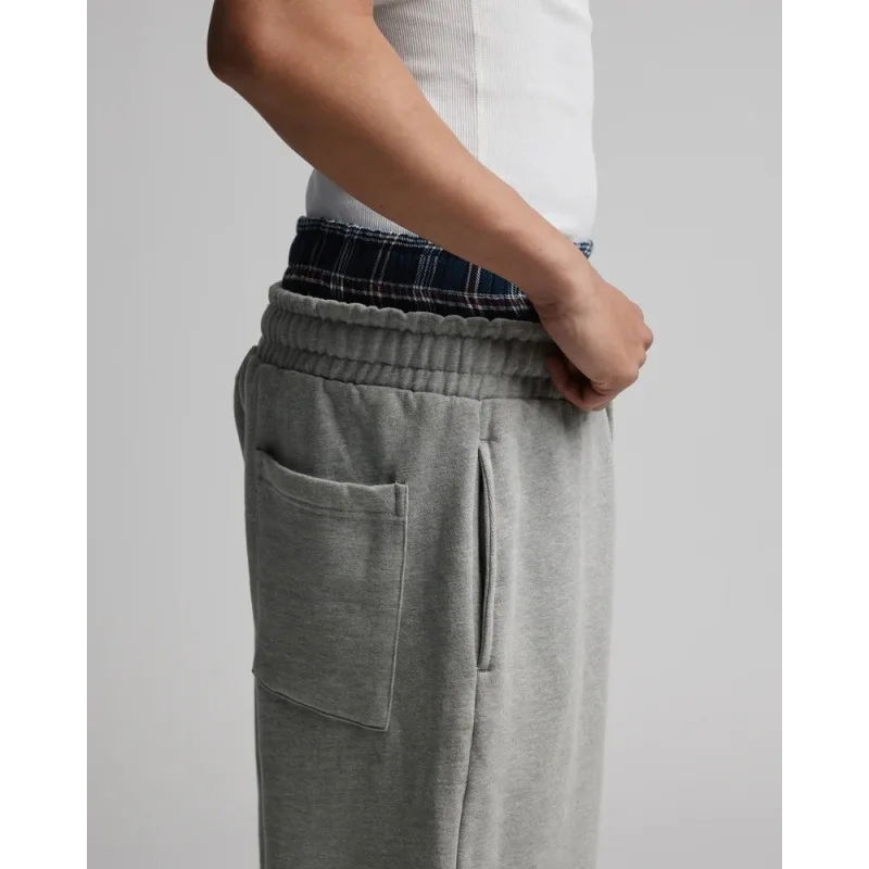 2025 Outono/Inverno Novo Europeu e Americano Harajuku Street cor sólida moda quente design de cintura dupla falsa calças de duas peças