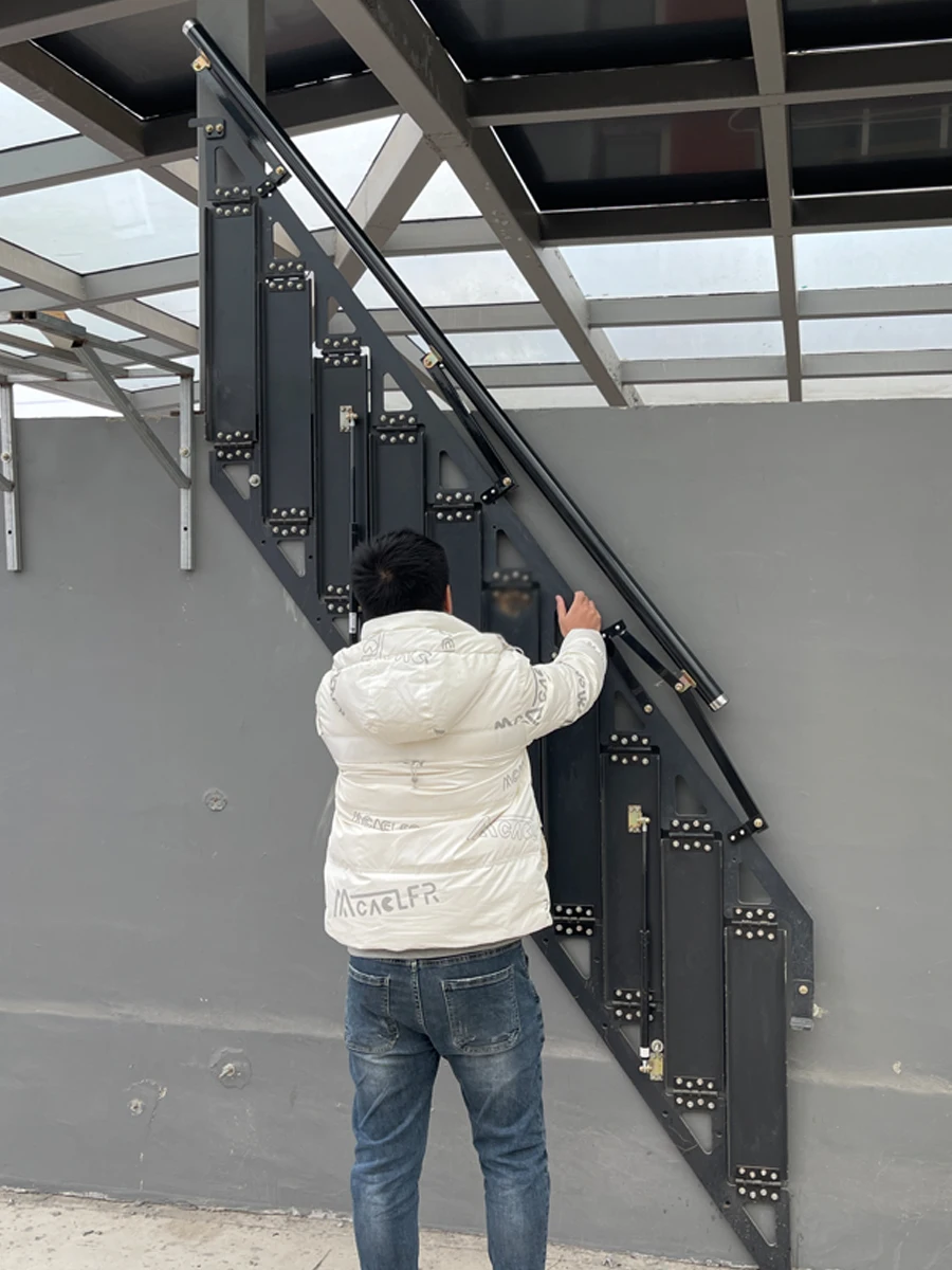 Stair wall of outdoor loft duplex apartment building with side pedal ladder in domestic attic