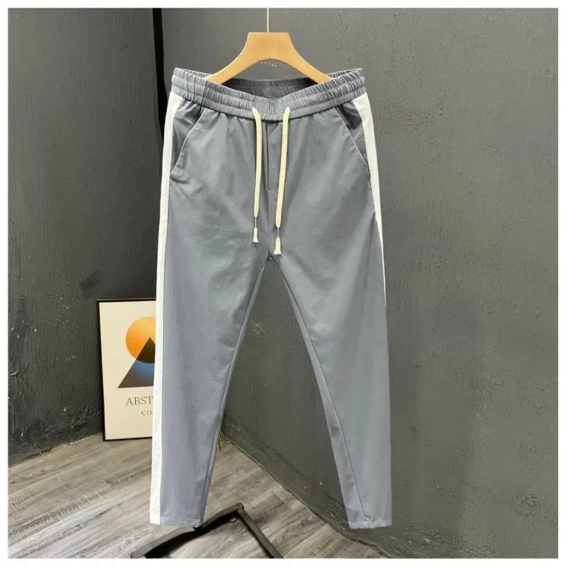 عارضة الرياضة الرجال مستقيم الساق رقيقة تمتد السراويل الخريف Faion العلامة التجارية المرقعة اللون السراويل الطويلة Sli تسع نقاط