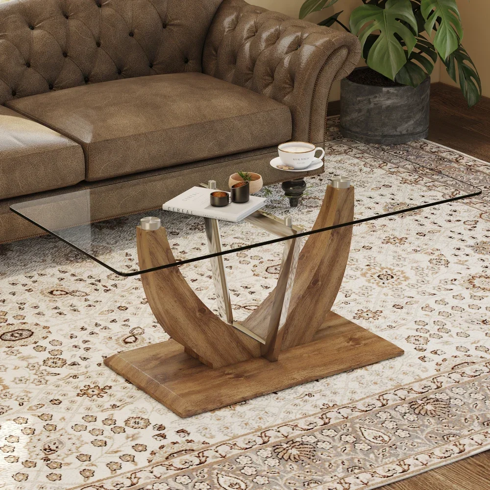 Modern minimalist clear tempered glass coffee table, wooden MDF legs and stainless steel decorative columns.