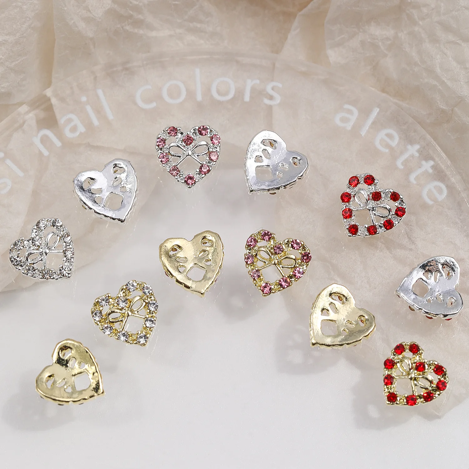 10 pièces 3D alliage de luxe évidé arc coeur Nail Art strass breloques manucure bijoux accessoires ongles décoration fournitures