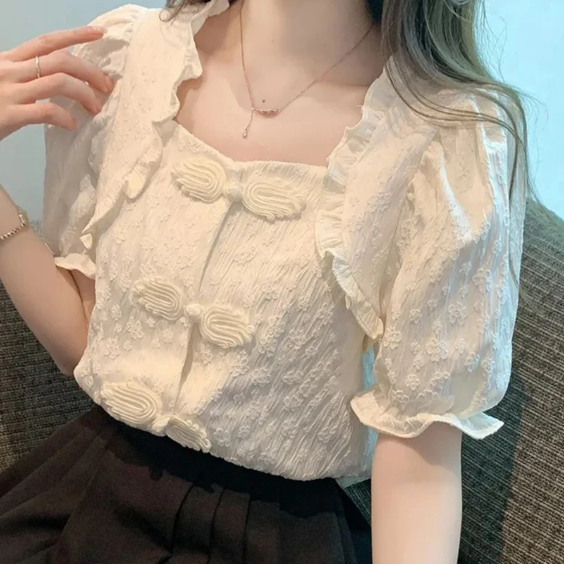 White shirt women's summer design retro buckle wood ear collar shirt chic versatile waist bubble sleeve top.