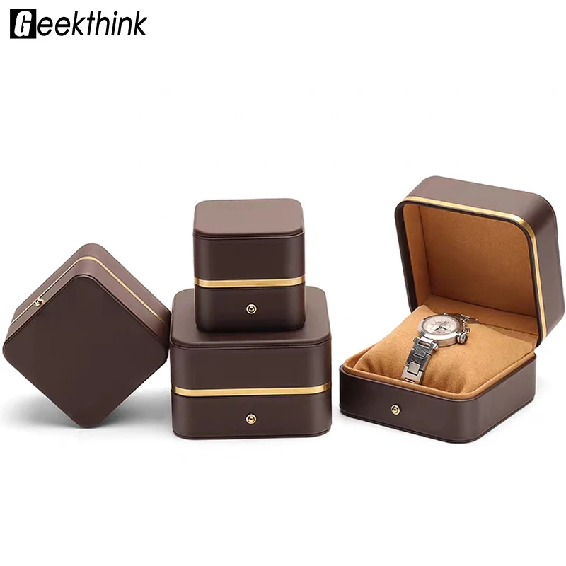 Luxuriöse Schmuckbox aus PU-Leder mit abgerundeten Ecken, Metallverschluss und Goldverzierung, geeignet zum Schutz von Uhren und Zubehör.