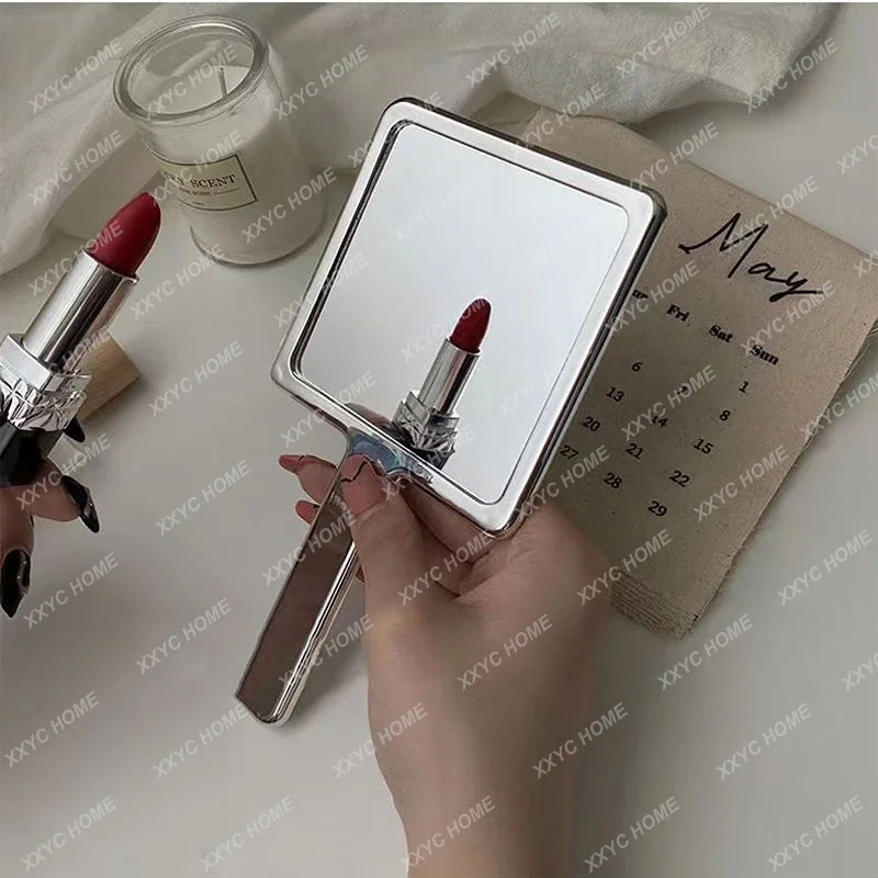 Hand held vanity mirror