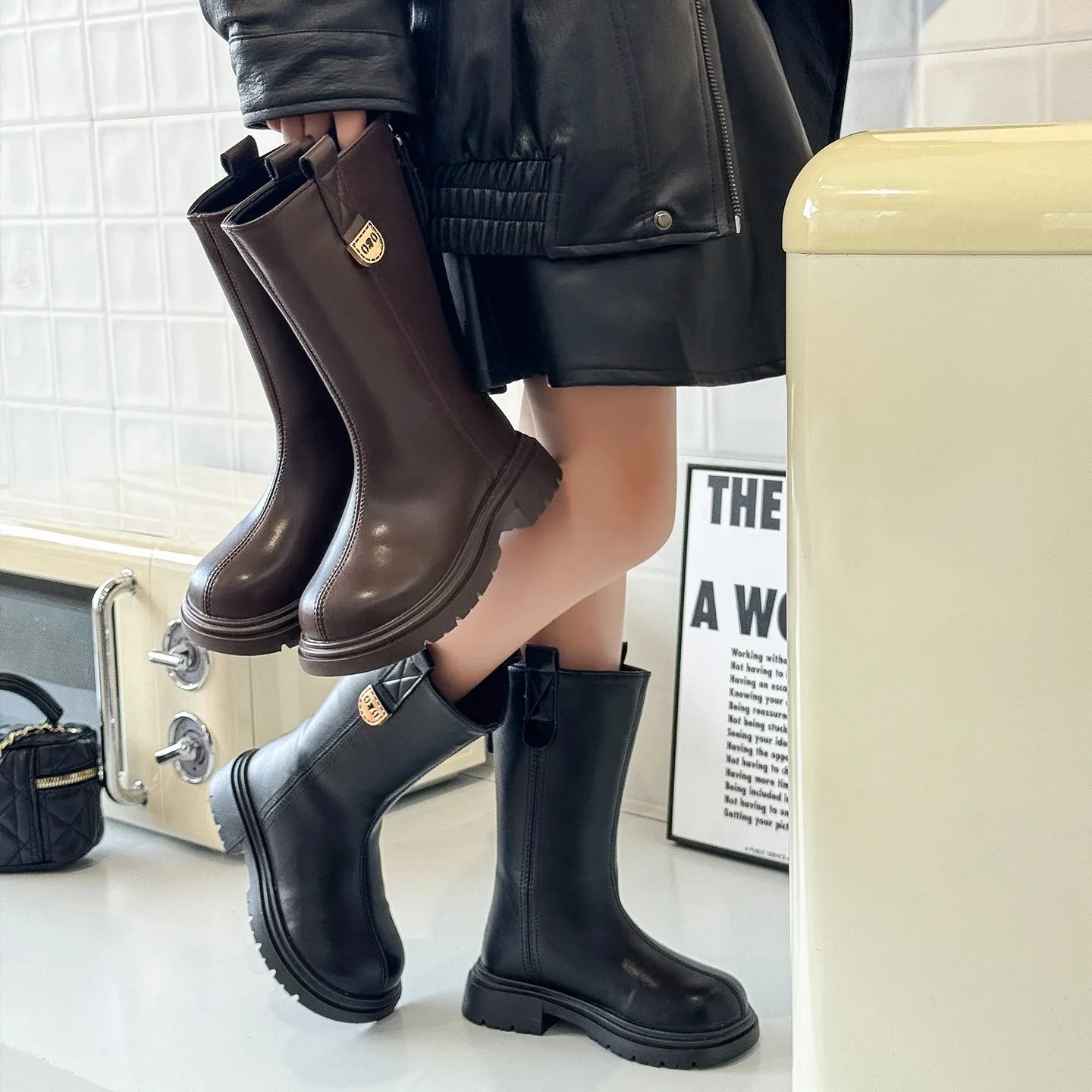 Classic style women's mid-length boots for autumn and winter. Leather material with side zipper. Thick sole for good grip.