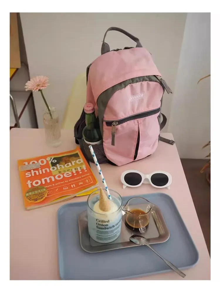 

Outdoor sports lightweight and comfortable backpack, women's pink decompression schoolbag travel backpack