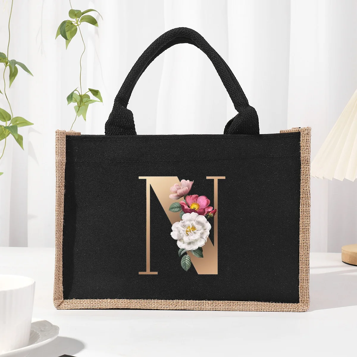 Black patch linen canvas tote bag with gold floral lettering, waterproof inside, large commuter bag storage bag