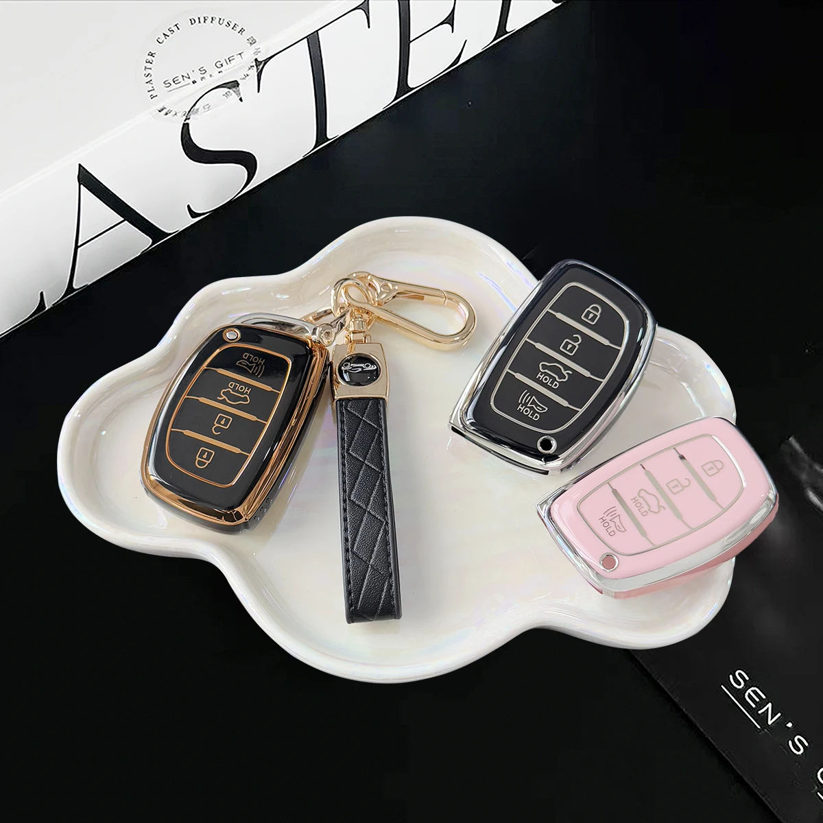 Keychain cover with exquisite hanging rope with car logo, car TPU pink/black silver/purple/black gold key case suitable for 4 bu