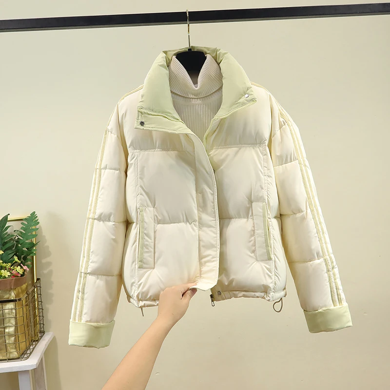 

2025 Winter Thiened down Cotton Jaet Women's Loose ort Sle Small Size Stand Collar Faionable Cotton Coat Outerwear