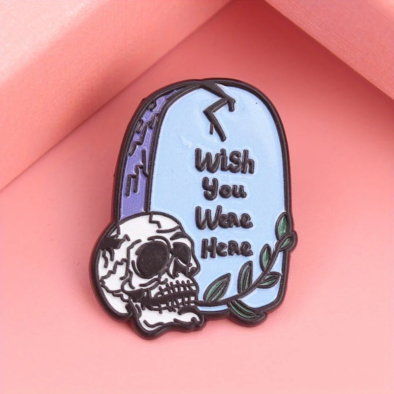 Morbid Greetings Enamel Pin - 'WISH YOU WERE HERE' Tombstone with Cracked Skull & Verdant Accents, Dark Humor Jewelry for Cemete