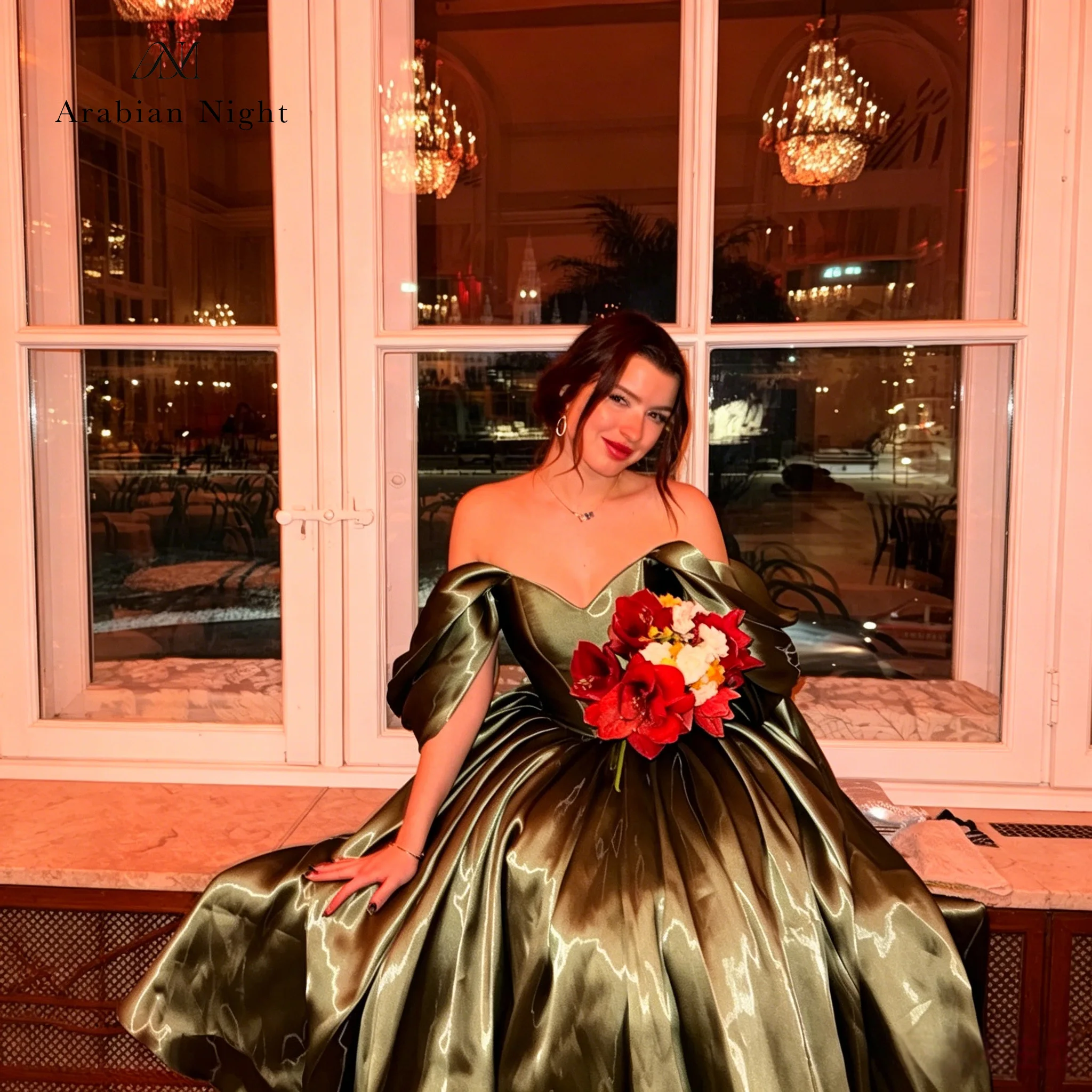 Classic green off-the-shoulder ball gown with a floor-length skirt, elegant and sophisticated, suitable for formal occasions.