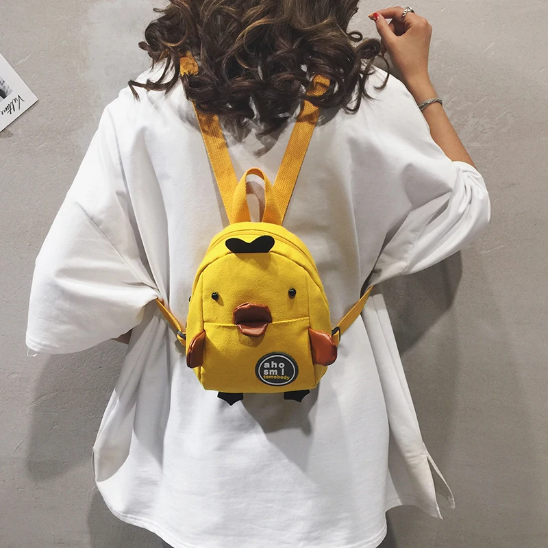 mochila-de-lona-estilo-coreano-com-desenho-de-patinho-para-meninas-bolsa-de-ombro-leve-e-impermeavel-em-amarelo