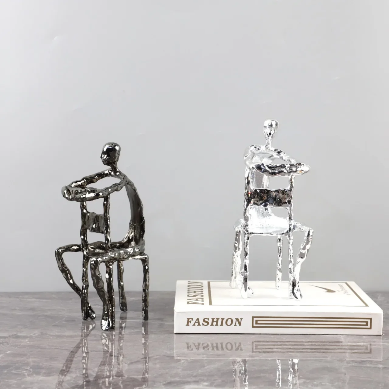 

Abstract Human Figure Metal Handicraft Chair Figure Sculpture Silver Metal Man Chair Man Decorative Figurines Home Decoration