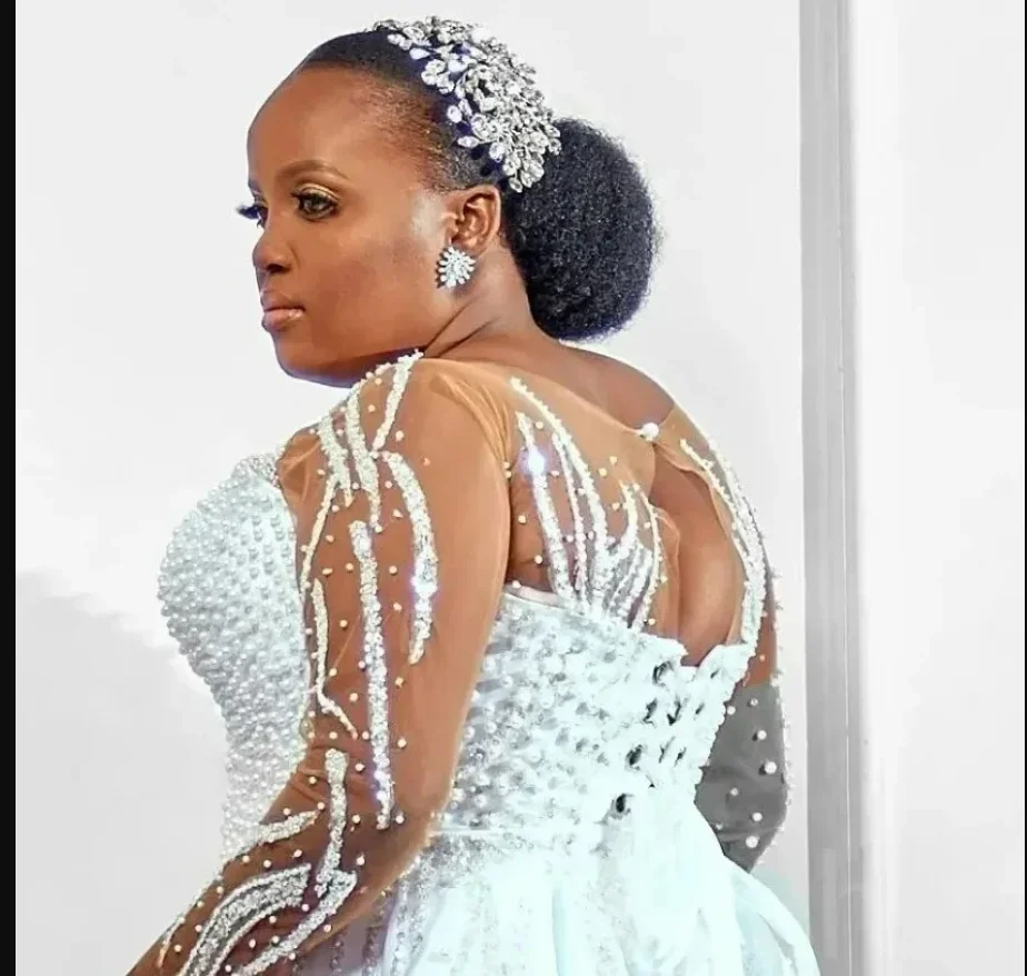 

Customized Sheer Neck Sparkly Pearls Beads Wedding Dress Vestidos De Novia Long Sleeves Bridal Gown with Removable Skirt