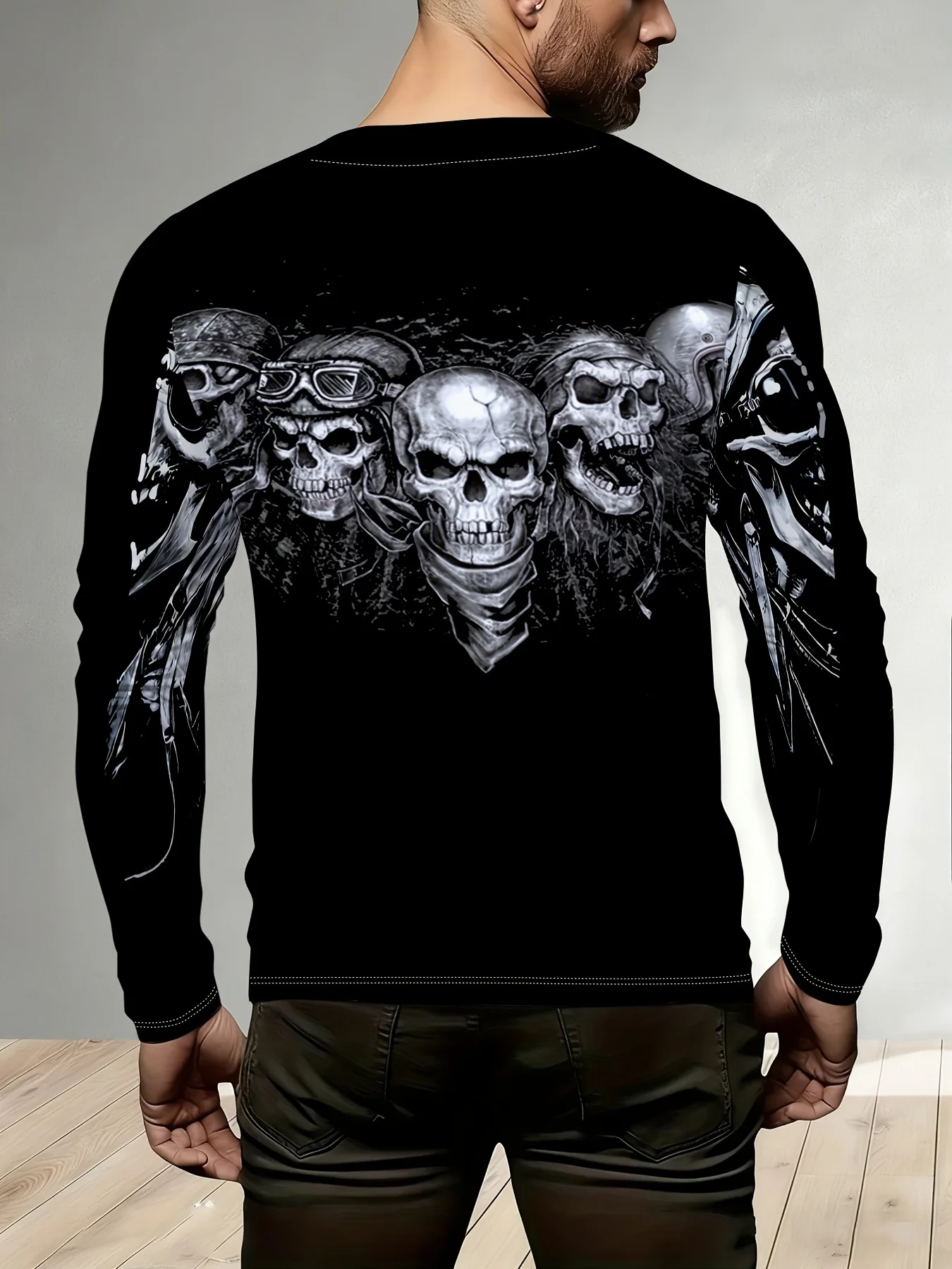 Men’s long-sleeve T-shirt featuring a row of skull-with-helmet prints; a casual, crew-neck long-sleeve top.