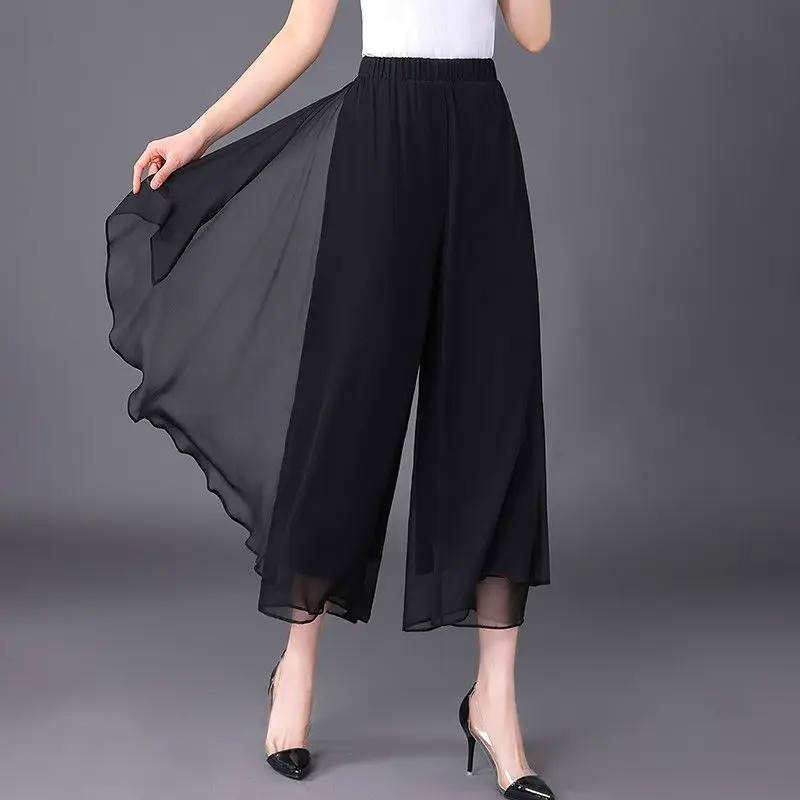 Pantalon Capri taille haute élastique pour femmes, vêtements d'été, ample, à la mode, couleur unie, épissé, en mousseline de soie, jambes larges, nouvelle collection 2025