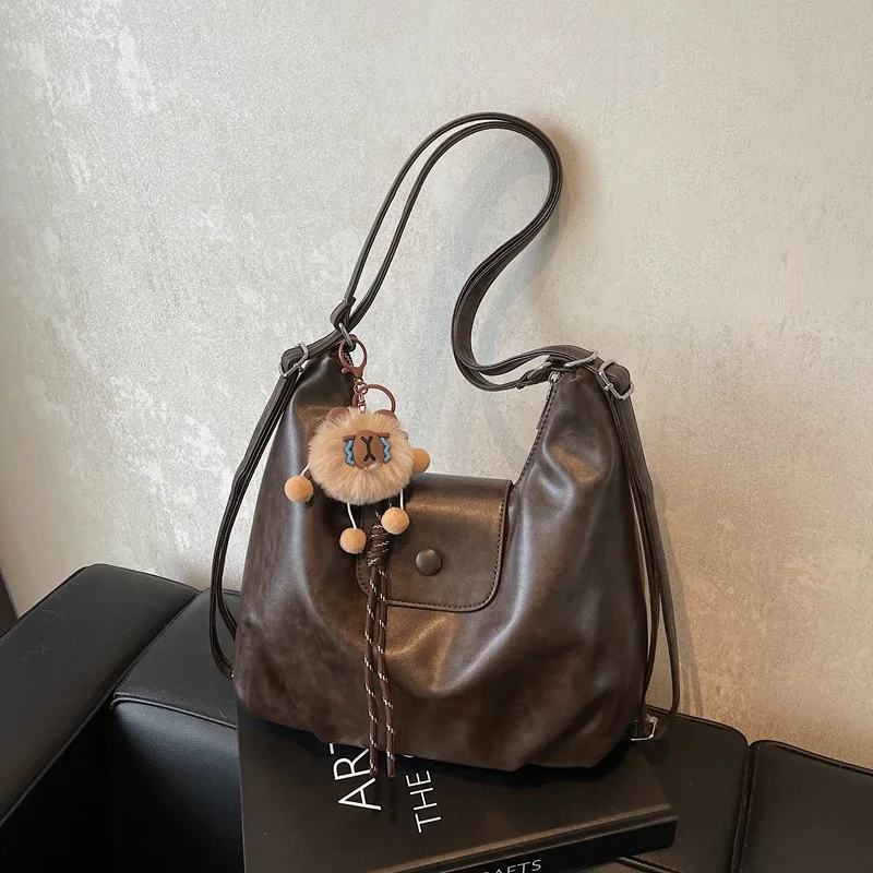 

Vintage PU Leather Shoulder Bag for Women, Lightweight Large Capacity Handbag with ornaments Commute Shopping Backpack Purse