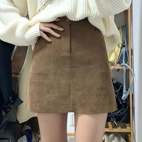 Autumn and Winter Age Reducing Retro Academy Style Loose and Fashionable Sweater Slimming Wrapped Hip Short Skirt Set