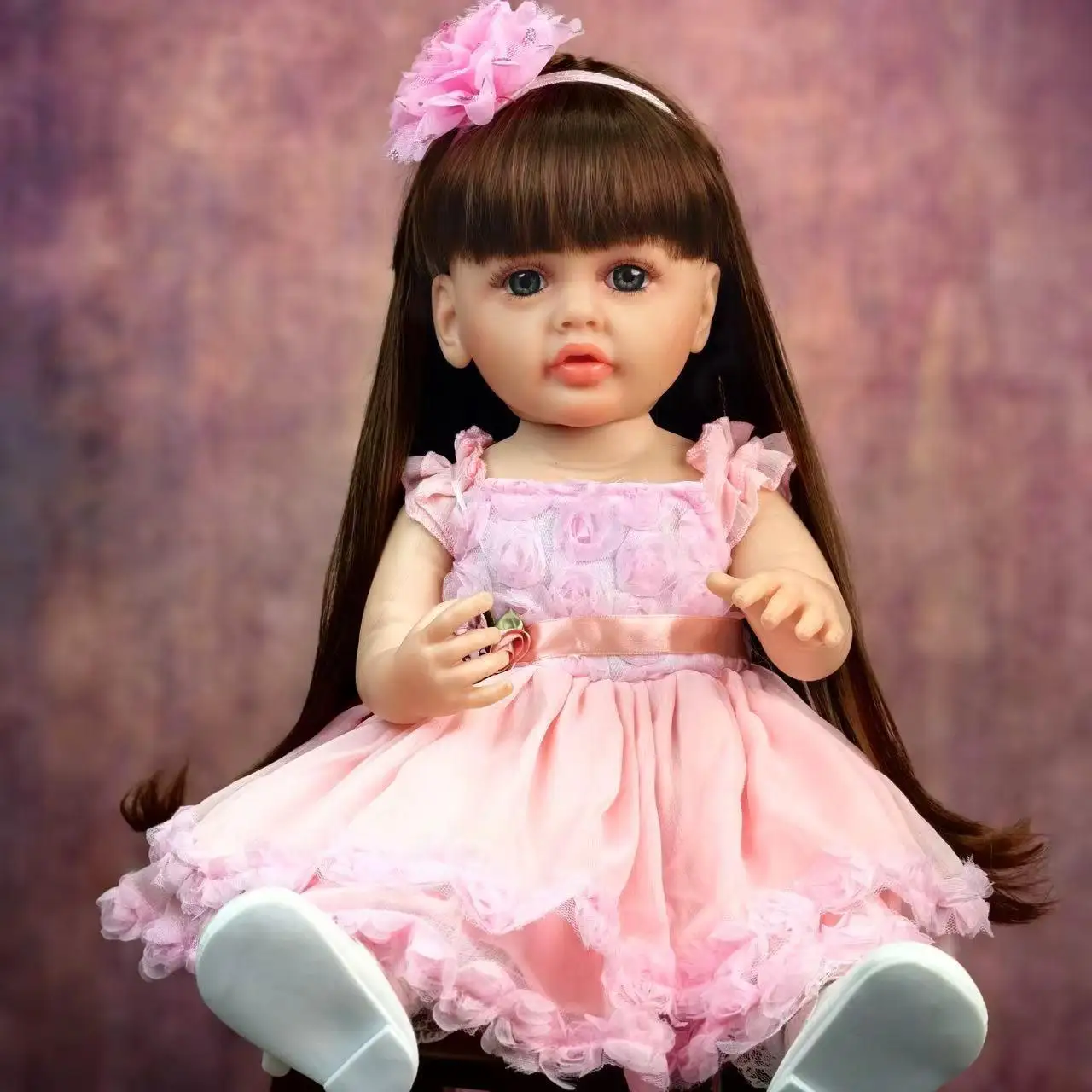 Lifelike 22 - Inch Reborn Baby Doll in Adorable Pink Outfit with Floral Decoration - Perfect for Gifting and Snuggling