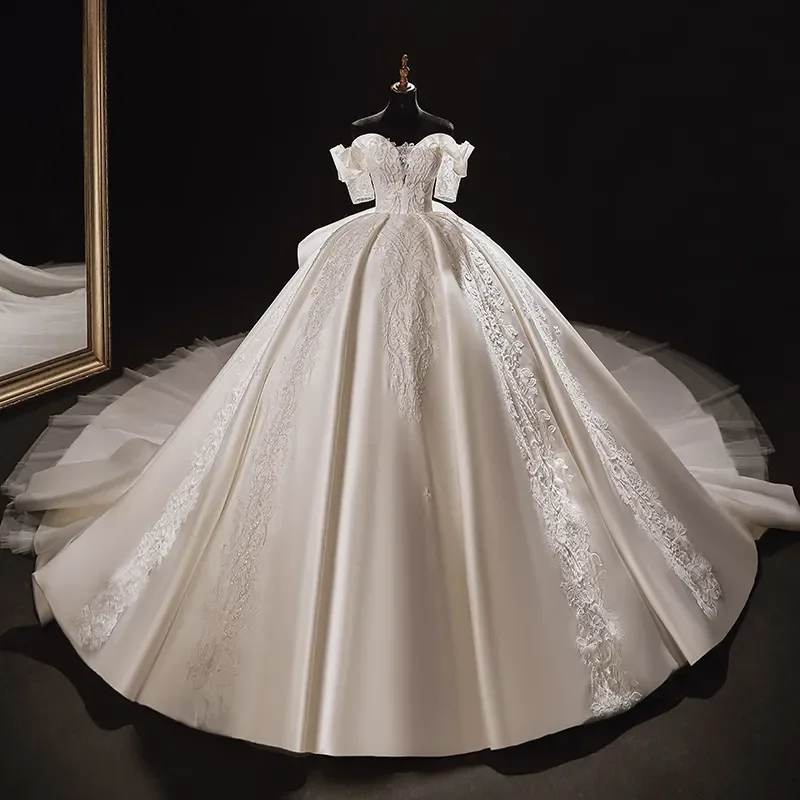 

Customized White Wedding Dress With Satin Lace Pattern Decoration Featuring A Long Trailing Skirt And A Backless Lace Design