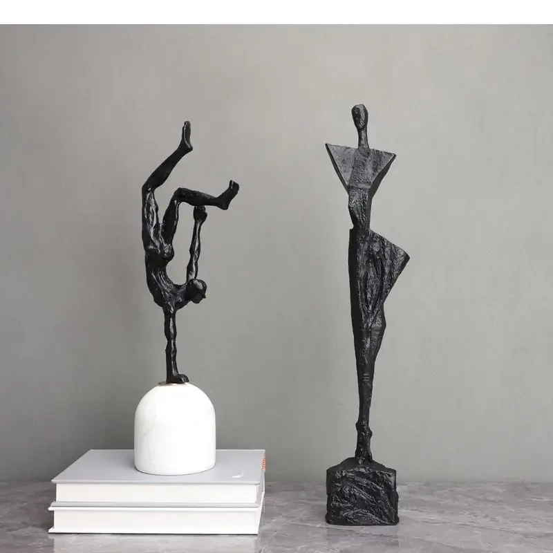 Sculpture humaine sur pied en fonte noire,