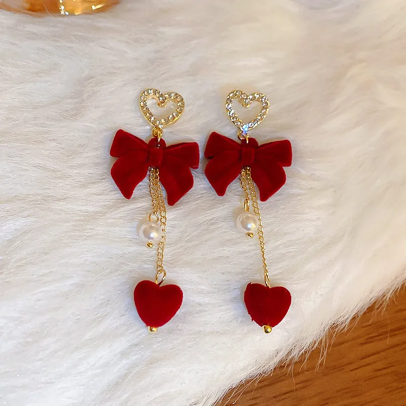 الأحمر توافدوا Bowknot ندفة الثلج ستار القلب الأقراط الطويلة عيد الميلاد الحلو الأزياء والمجوهرات النساء هدايا السنة الجديدة