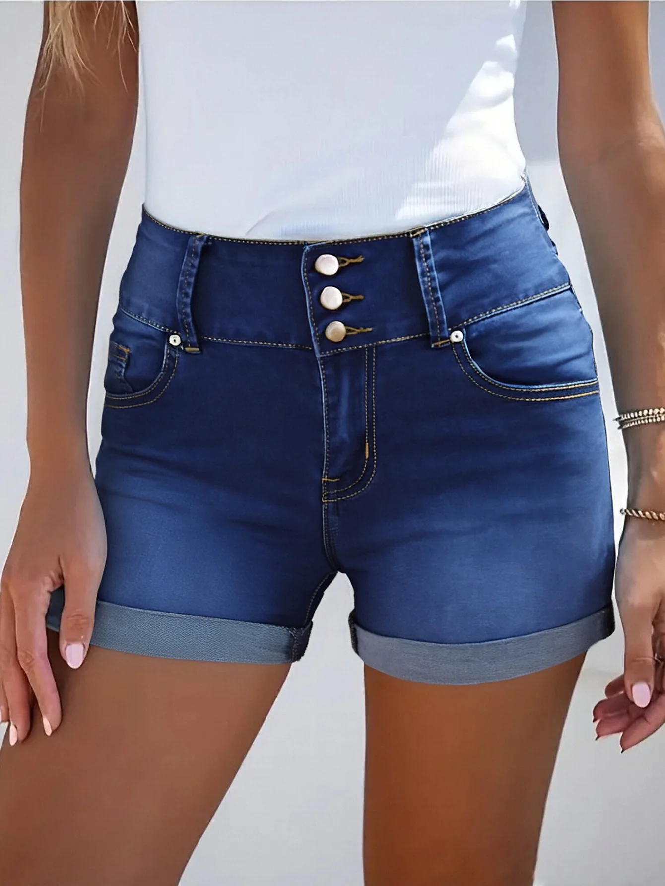 

Women's casual stretch denim shorts with turned-up cuffs and three-button design, perfect for summer casual looks.