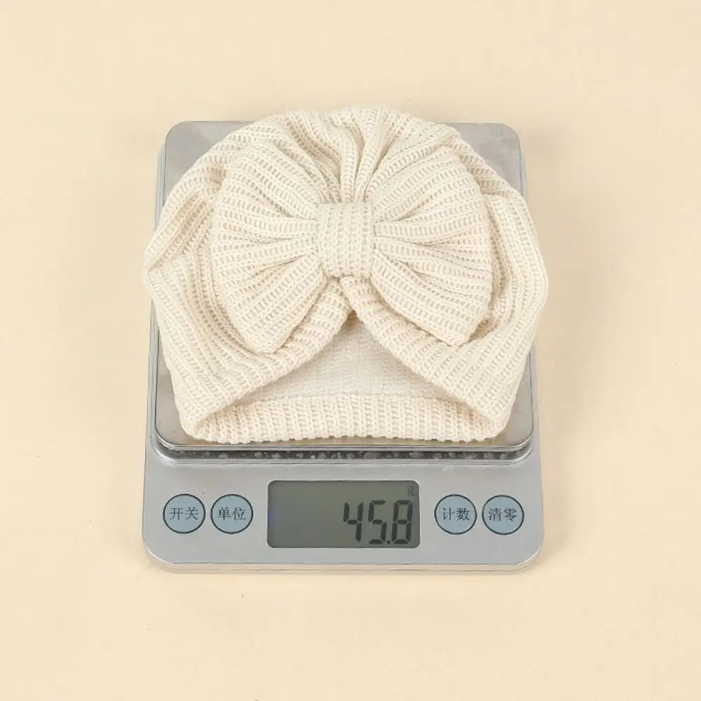 جديد لطيف Bowknot محبوك عمامة بلون دافئ الرضع قبعة قبعة مطاطا البلوز كاب Headerap