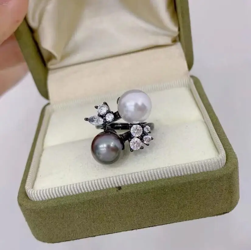 

Элегантное кольцо с круглым белым и черным жемчугом Южного моря 10-11 мм 925-х годов