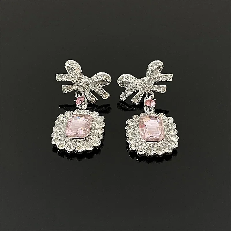 

Pink zircon bow stud earrings women's light luxury niche design sense high-end unique earrings earrings