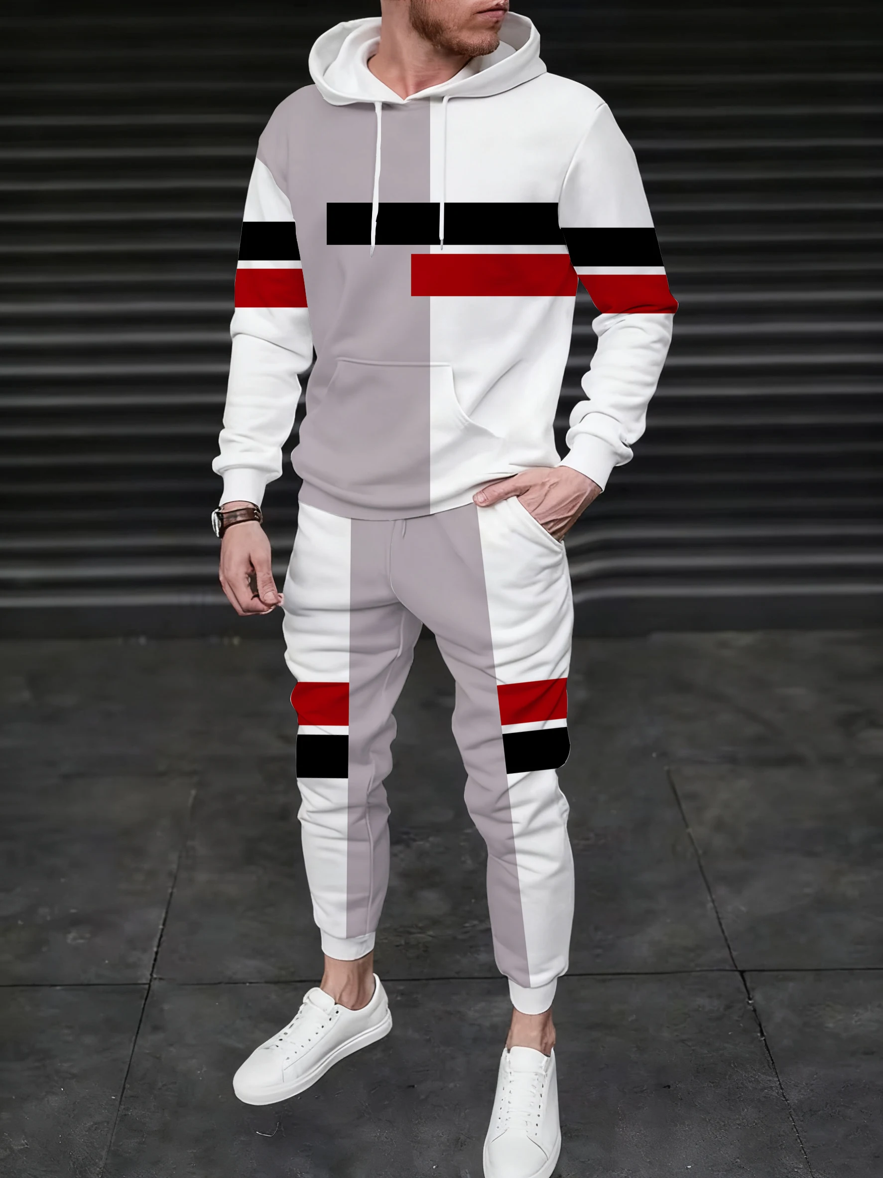 

A men's hooded sweatshirt paired with sweatpants, with lines and contrasting color patterns, is a versatile street style match