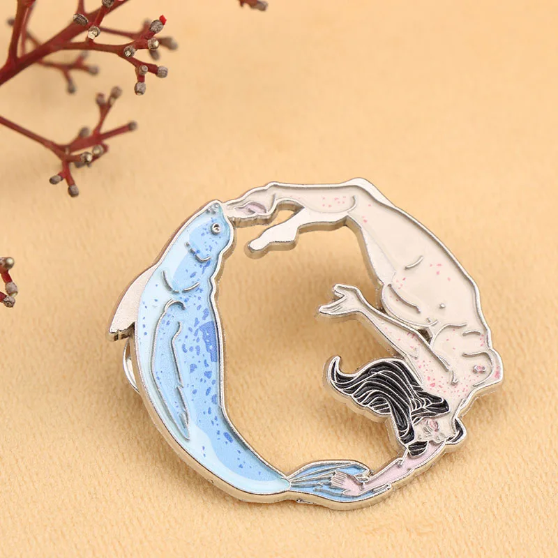 Enchanting Mermaid - Dolphin Enamel Pin.Great for wearing at beach parties or as an everyday accessory with a nautical touch.