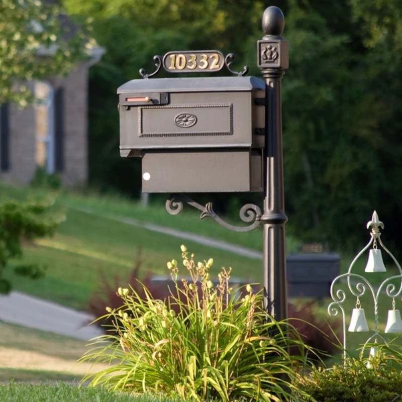 Red post mail box standing wrought iron mailbox