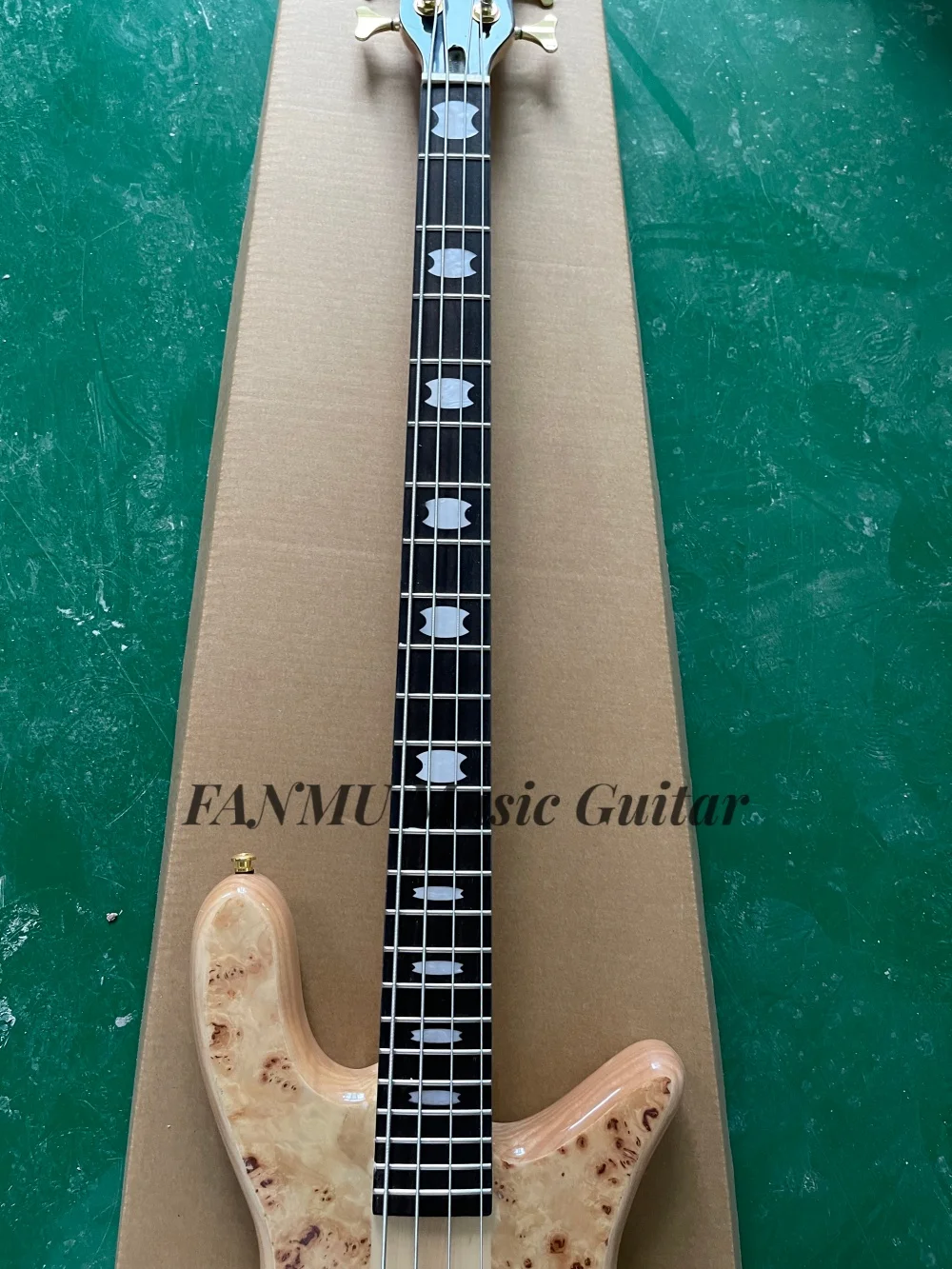 4 string natural bass, Burl maple top, fixed bridge, maple neck through ash body, active battery,golden tuners