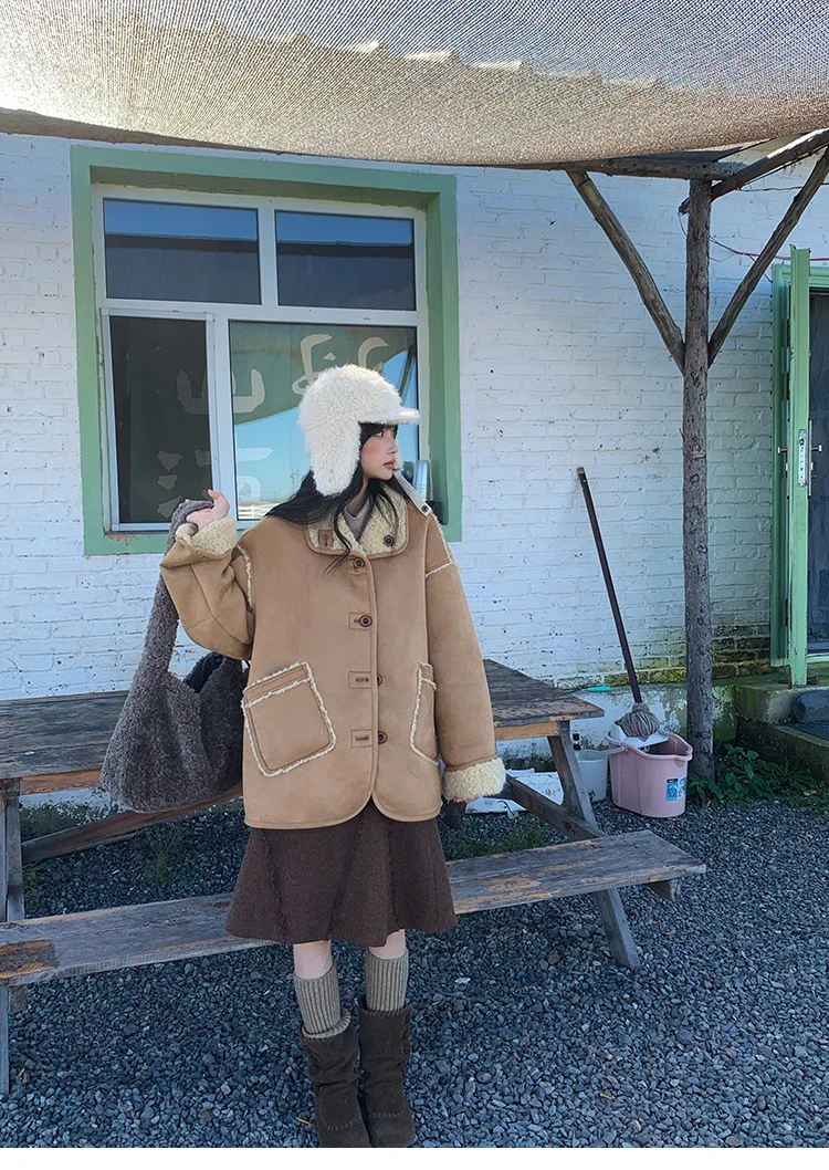 A double-sided wearable fur coat for women, a retro and eco-friendly winter coat made of fur and suede